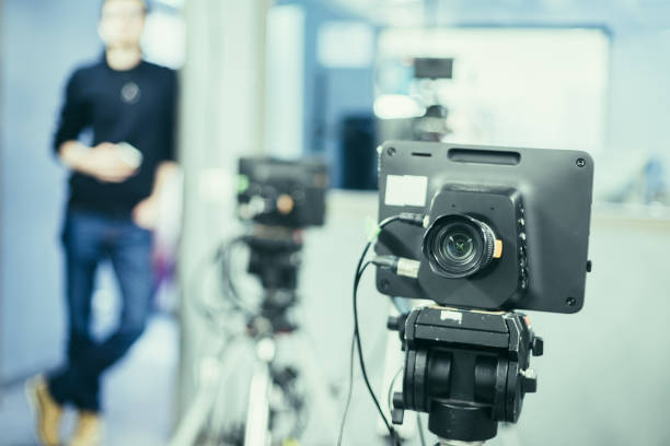 istock Modern film camera and cameraman in a broadcasting studio 1133560018