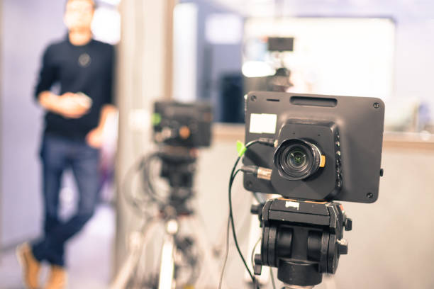 istock Modern film camera and cameraman in a broadcasting studio 1133560019