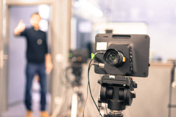 istock Modern film camera and cameraman in a broadcasting studio 1133560028