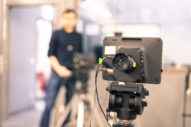 istock Modern film camera and cameraman in a broadcasting studio 1133560033