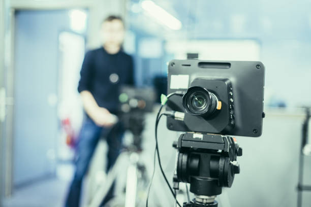 istock Modern film camera and cameraman in a broadcasting studio 1133560034