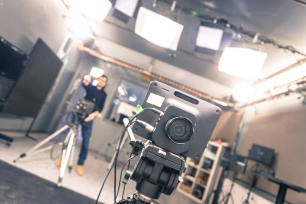 istock Modern film camera and cameraman in a broadcasting studio 1133560070