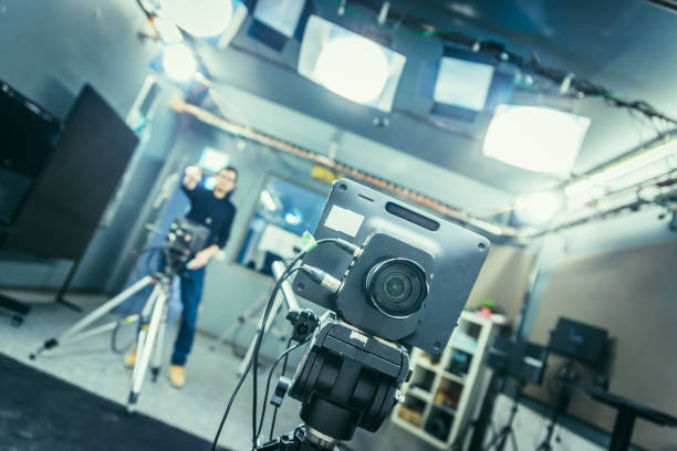istock Modern film camera and cameraman in a broadcasting studio 1133560071
