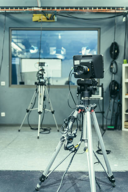 istock Modern film camera on a tripod in a broadcasting studio, spotlights and other equipment 1133560113