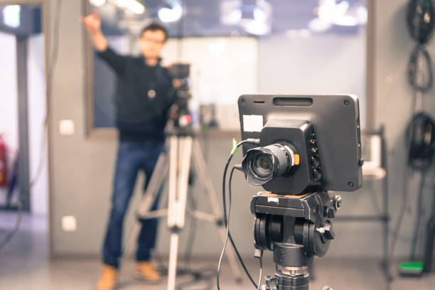 istock Modern film camera and cameraman in a broadcasting studio 1133560157