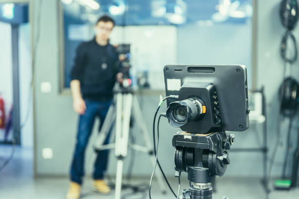 istock Modern film camera and cameraman in a broadcasting studio 1133560161