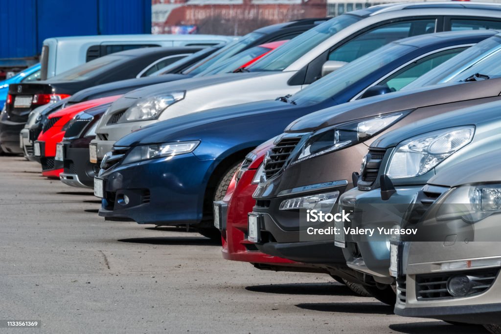 In the Parking lot. View of the front of the cars parked in a row in the city Parking lot. Car Stock Photo