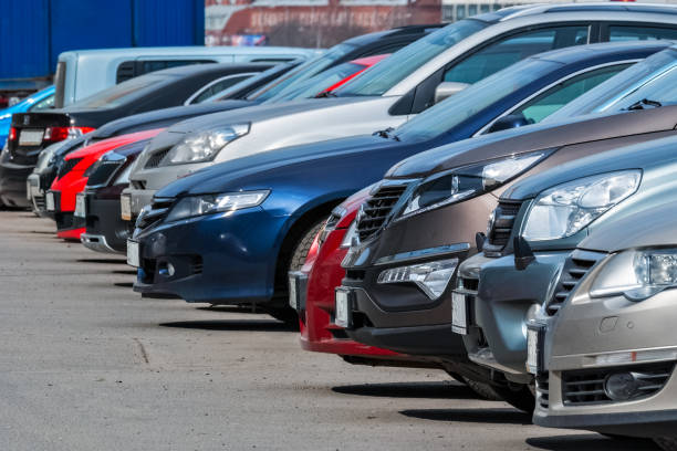 In the Parking lot. View of the front of the cars parked in a row in the city Parking lot. large group of objects stock pictures, royalty-free photos & images