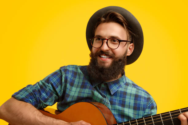 istock Hipster with guitar looking away 1133562899
