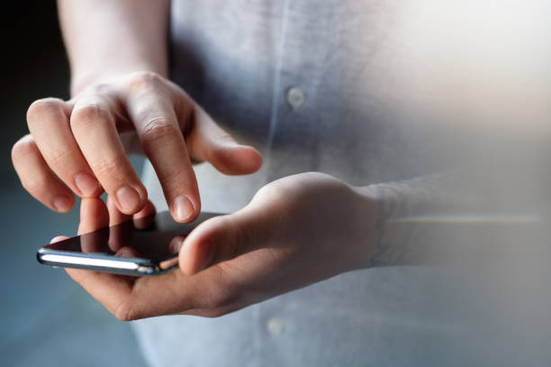 istock Men's hands with a phone 1133562902