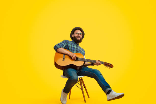 istock Trendy hipster playing guitar and singing 1133562908