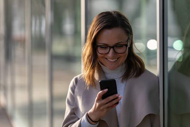 istock Woman looking at her phone 1133563106
