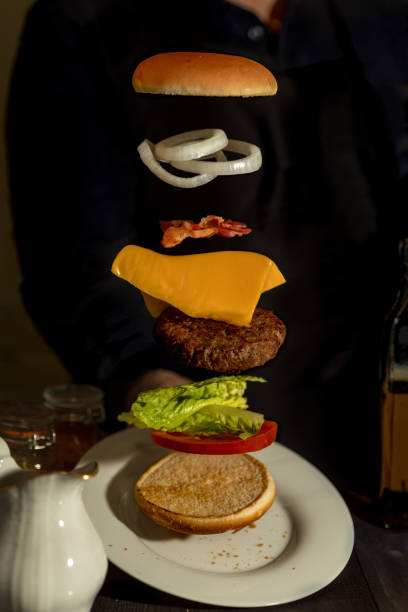 istock Sandwich with flying ingredients offered on white plate 1133566979