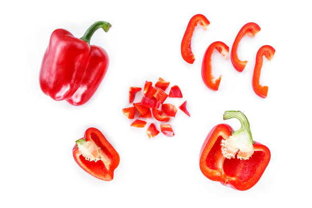 istock red bell pepper cut into pieces on white background top view. 1133567070