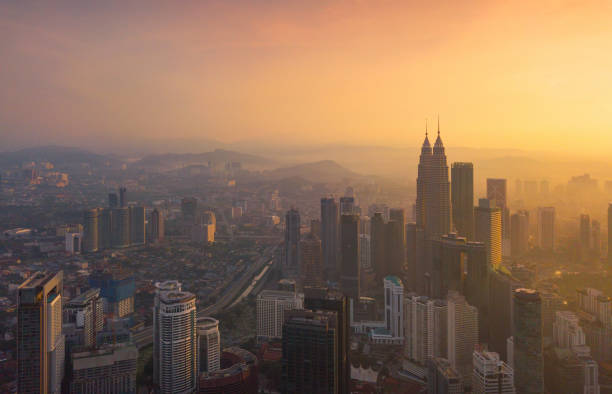 Aerial view of Kuala Lumpur Downtown, Malaysia. Financial district and business centers in smart urban city in Asia. Skyscraper and high-rise buildings at sunset. Aerial view of Kuala Lumpur Downtown, Malaysia. Financial district and business centers in smart urban city in Asia. Skyscraper and high-rise buildings at sunset. kuala lumpur photos stock pictures, royalty-free photos & images