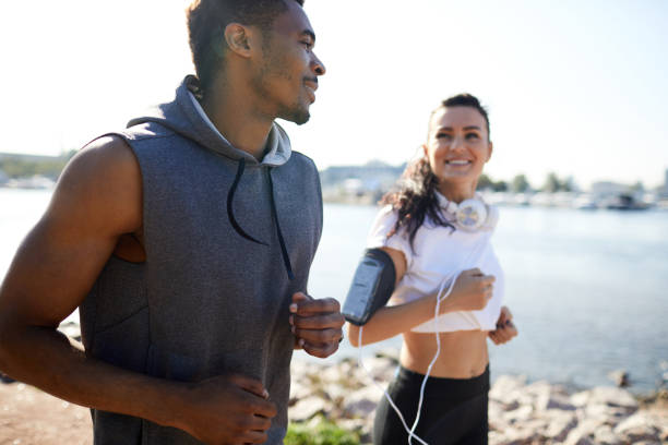 istock Excited energetic couple chatting and jogging 1133568224