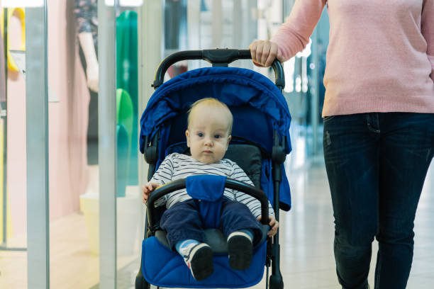 istock Woman with a baby in a stroller in a mall 1133568587