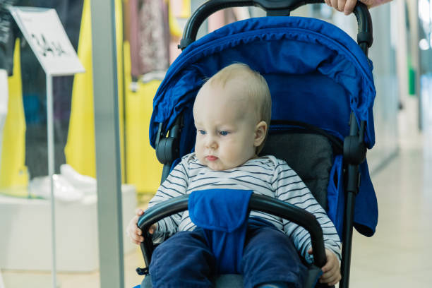 istock Little baby in a stroller in the mall 1133568605