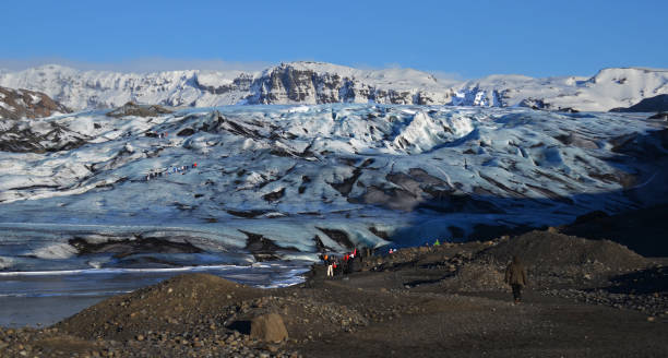 istock Huge white glacier in the background mountains 1133568844