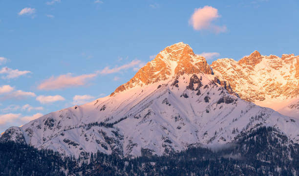 Free Stock Photo of Sunset glow over a snowy mountain peak | Download ...