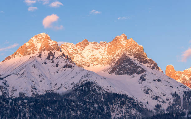 istock Idyllic snowy mountain peaks, setting sun in winter, landscape, Alps, Austria 1133570279