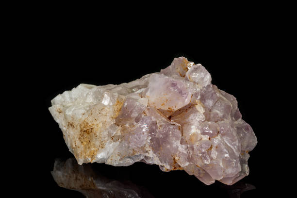 istock Macro mineral amethyst quartz stone on a black background 1133570752