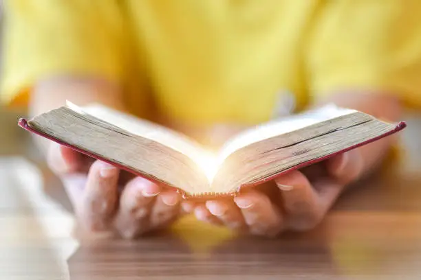 Photo of Women reading the Holy Bible.,Reading abook.