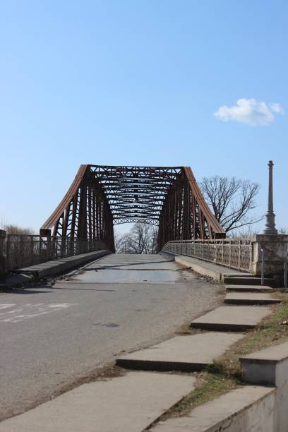 istock Steel old bridge over a river 1133573566