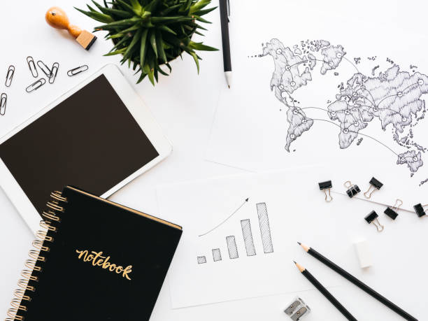 istock Business background with different office supplies and sketches and notes 1133575138