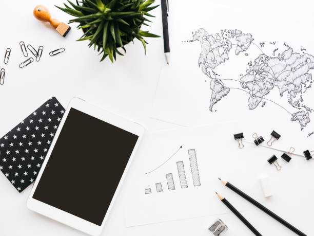 istock Business background with different office supplies and sketches and notes 1133575172