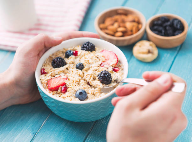 istock Man is eating muesli with milk 1133576689