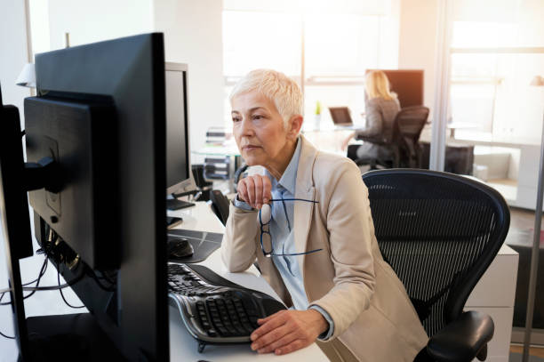 istock Mature business women working at the office 1133576853