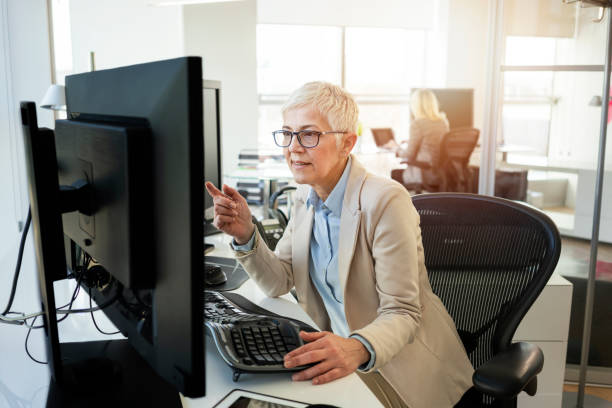 istock Mature business women working at the office 1133576894