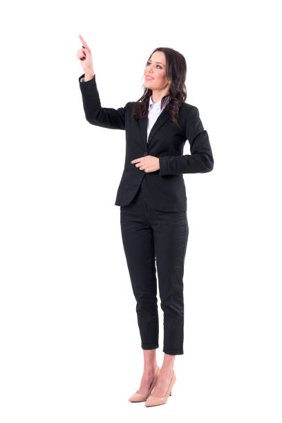 Friendly smiling business woman pointing finger using touch screen on virtual reality. stock photo