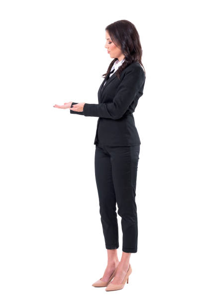 istock Female business assistant presenting and showing blank copy space. 1133578249