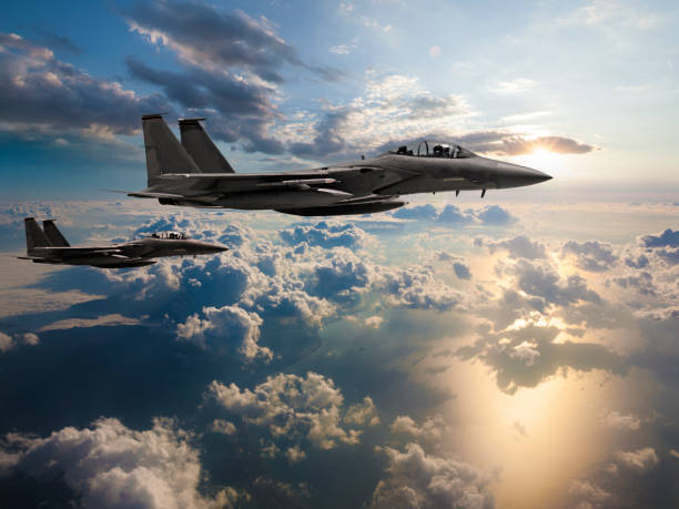 istock Fighter Jets flying over the ocean at sunset 1133578423