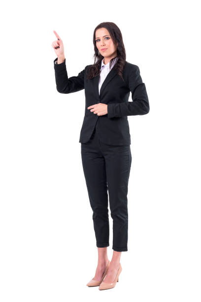 istock Young pretty confident business woman pointing finger at copyspace. 1133578460