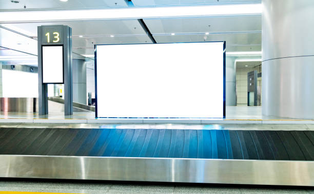 blank billboard at baggage claim - conveyor belt fotos imagens e fotografias de stock