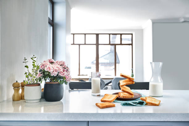 istock A glass of milk and toast on a table, kitchen background. 1133581677
