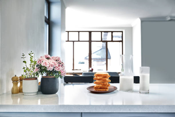 istock A glass of milk and toast on a table, kitchen background. 1133581706
