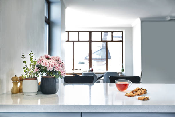 istock Breakfast scene at sunny morning. Transparent black tea mug with biscuit on kitchen table 1133581739