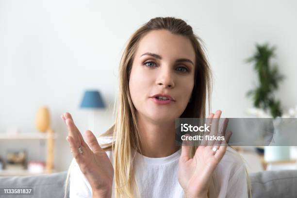 Head Shot Portrait Talking Woman Looking At Camera Video Call Stock Photo - Download Image Now