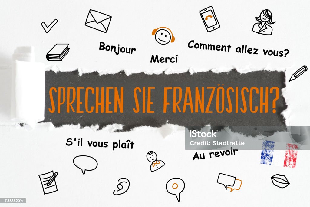 A piece of paper and question Speak French A sheet of paper and question Speak French Alphabet Stock Photo