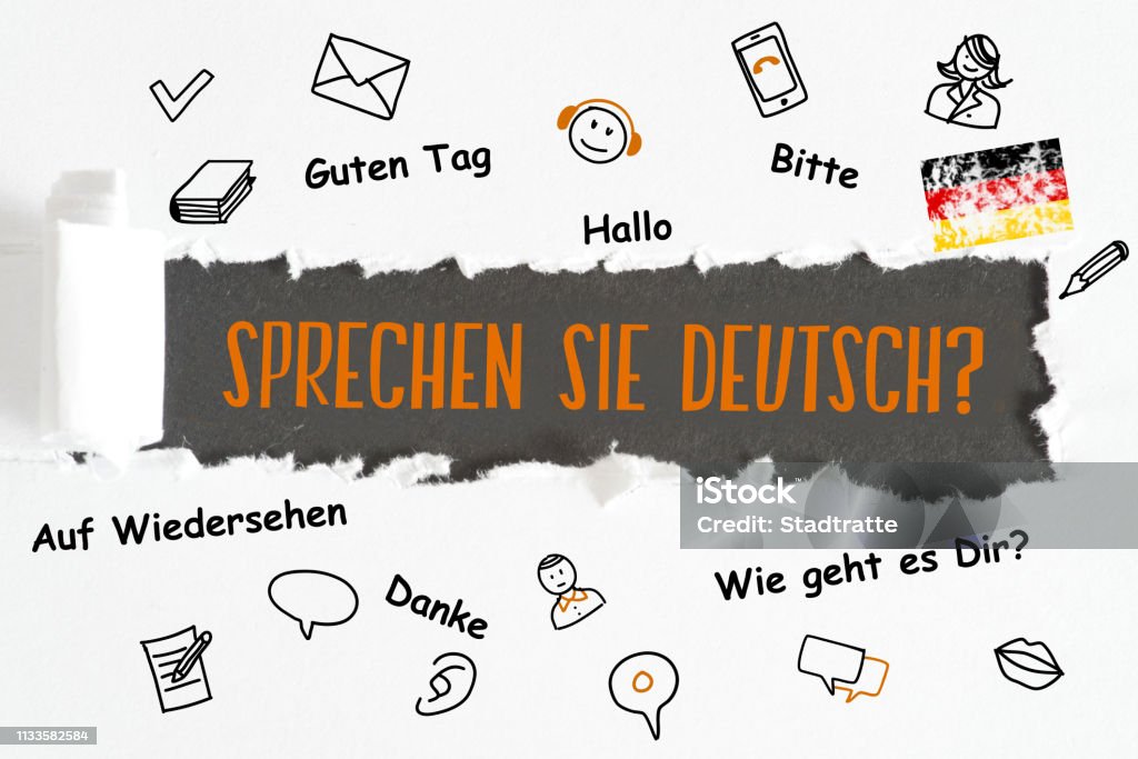 A piece of paper and question Speak German A piece of paper and a question Talk german Alphabet Stock Photo