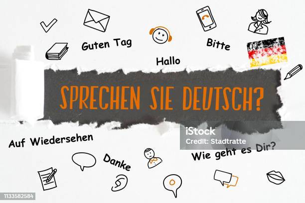 A Piece Of Paper And Question Speak German Stock Photo - Download Image Now - Alphabet, Classroom, Computer Software