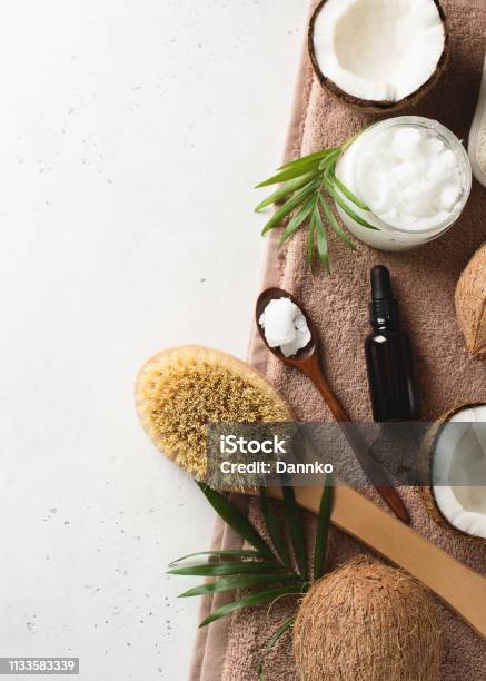 Dry Massage Brush With Coconuts Oil Health Wellness Concept With Accessories On White Background Stock Photo - Download Image Now