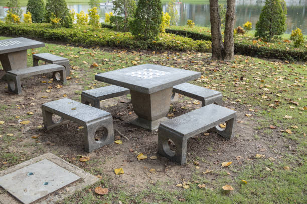 stone table with checkerboard in the garden.