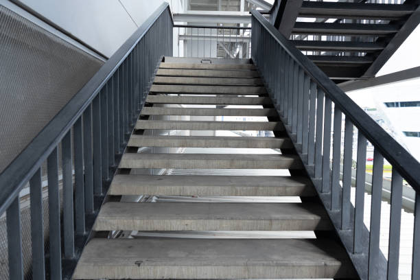 istock Empty concrete staircase with black steel handrail. 1133585002