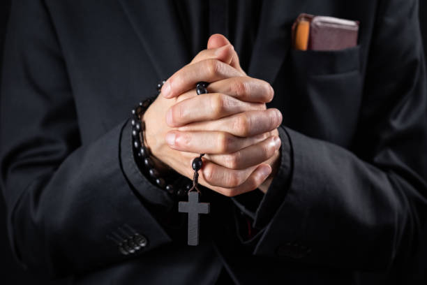 istock Christian person praying, low key image. 1133585171