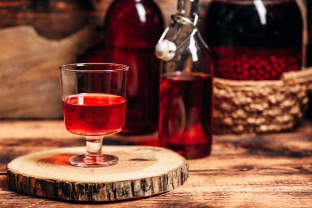 Homemade red currant liquor Homemade red currant liquor in glass nalewka stock pictures, royalty-free photos & images